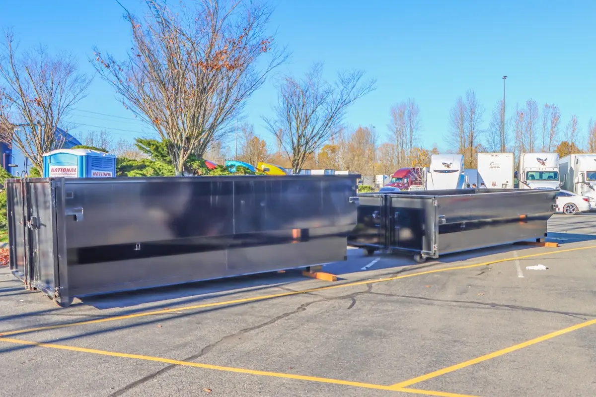 Professional dumpster rental service with roll-off container on residential driveway in Mount Zion